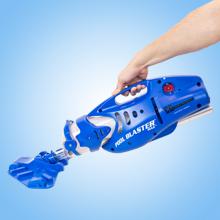 Hand holding Pool Blaster Max CG rechargeable pool vacuum by the handle