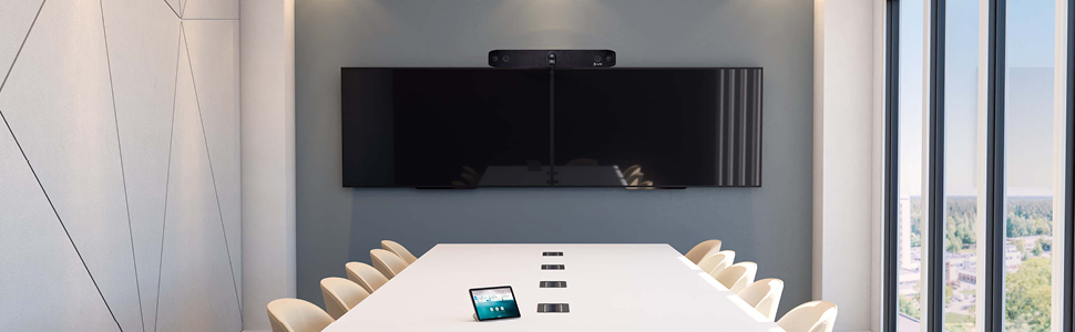 Poly Studio X70 video bar in conference room in office with TC8 touch screen on table