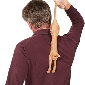 Adult using back scratcher