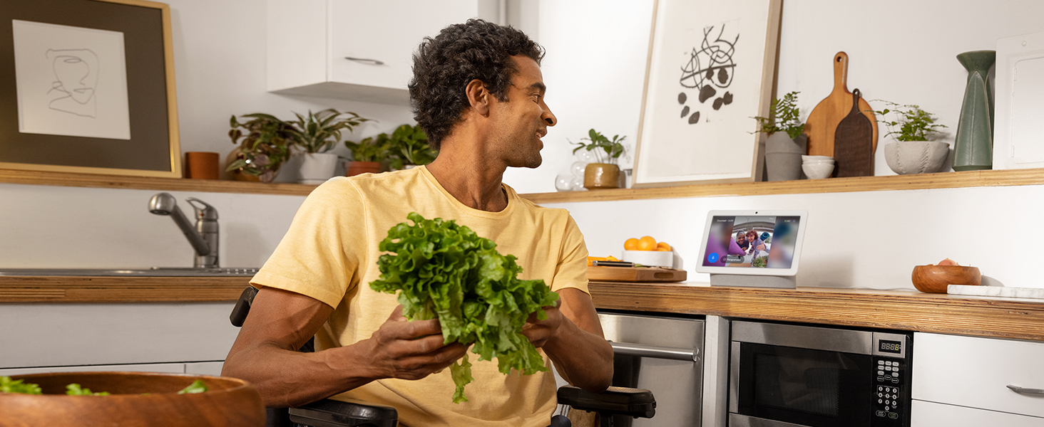 Person talking to their voice assistant display device