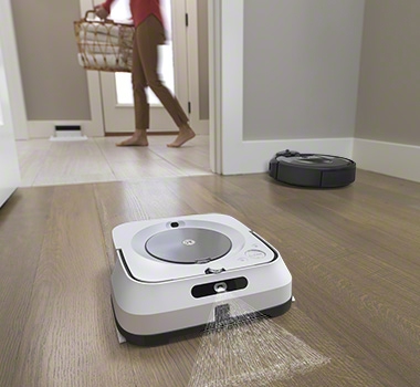 iRobot Roomba i7 and a robot mop are working together