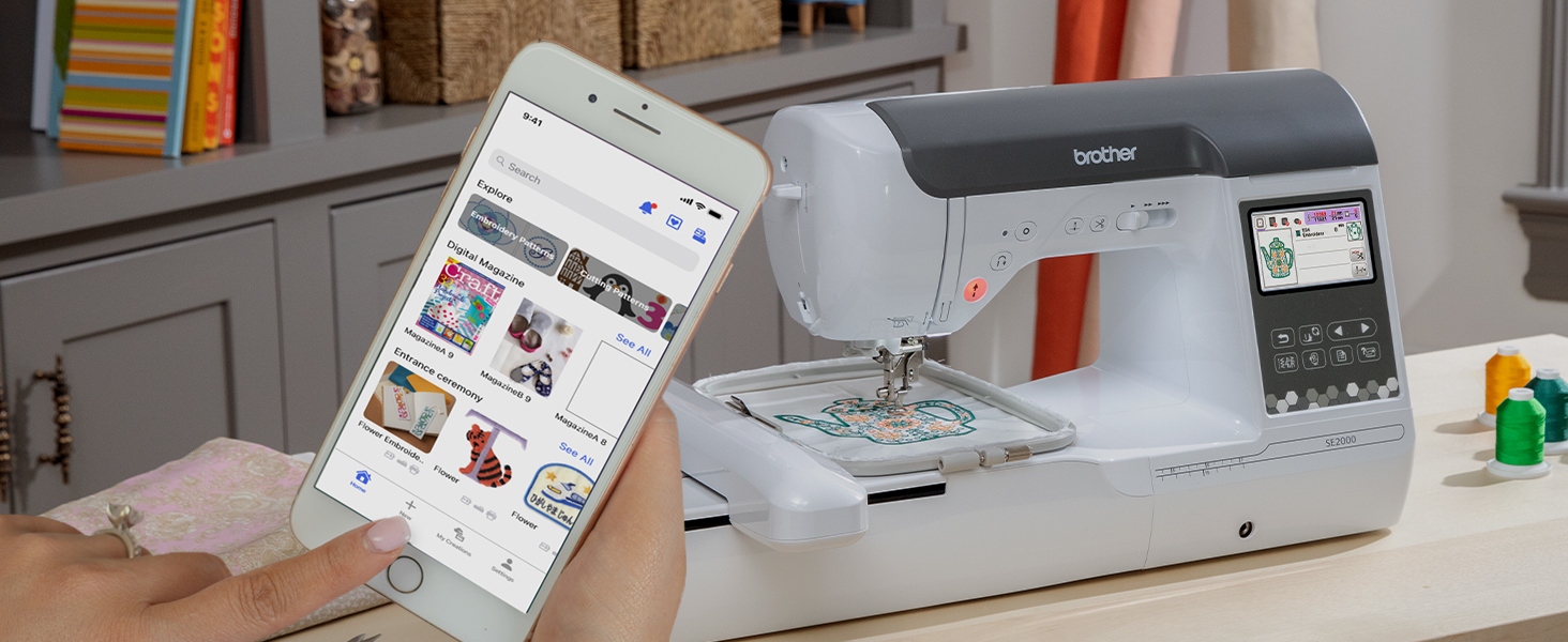 Person browsing designs in Artspira app on smartphone to use on SE2000 sewing & embroidery machine