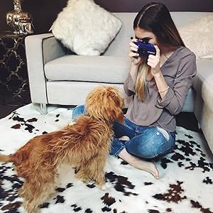 girl taking photo with white camera 