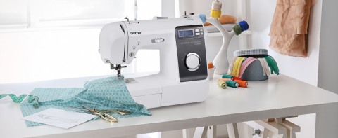 machine on table with sheer aqua fabric 