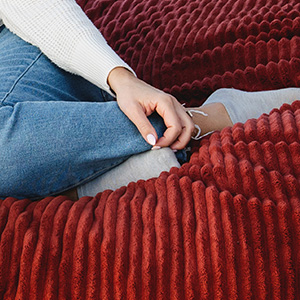 Woman sitting on bean bag chair, Premium Fabric