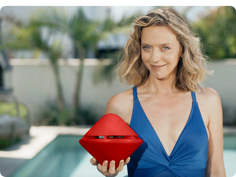 woman holding device with pool alarms for inground pools kids