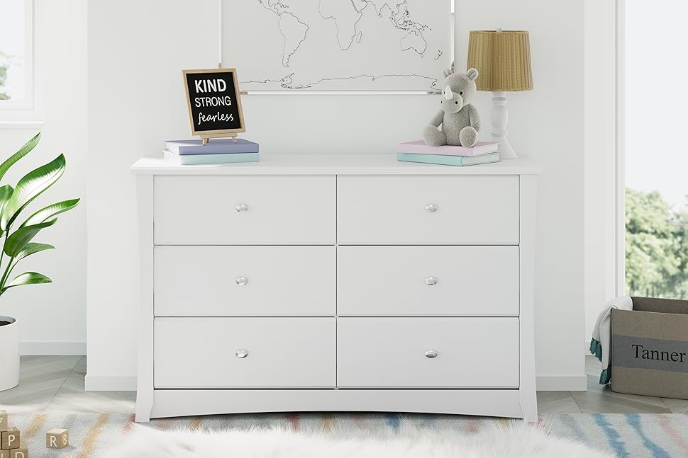 White Storkcraft Crescent 6 Drawer Dresser in nursery